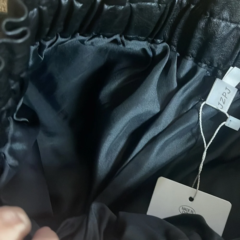 SCHHJZPJ size Medium pleather shorts. Black. Pockets. New!